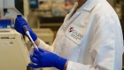 A scientist at Gilead Sciences works in a laboratory in Foster City, California 