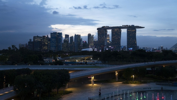 The cooling tower, left, is located near the Marina Bay Sands hotel. Photographer: Wei Leng Tay/Bloomberg