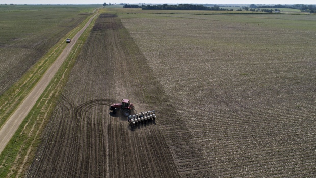 A farmer pulls a planter through a soybean field in this aerial photograph taken over a farm near Buda, Illinois, U.S., on Tuesday, July 2, 2019. The USDA's World Agricultural Supply and Demand Estimates (WASDE) report is scheduled for release on July 11. Photographer: Daniel Acker/Bloomberg