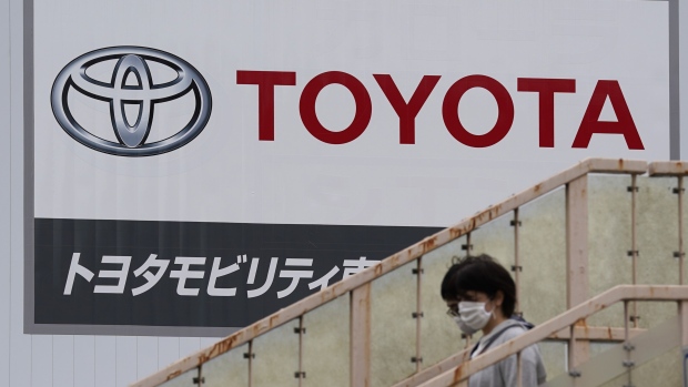 Signage is displayed outside a Toyota Motor Co. dealership in Tokyo, Japan, on Sunday, May 10, 2020. Global automakers and suppliers are on track to get at least $100 billion of bank financing as the coronavirus pandemic hammers car sales. Photographer: Toru Hanai/Bloomberg