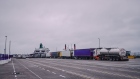 A row of trucks wait to board a ferry crossing the Irish Sea as a vessel, operated by Irish Ferries Ltd., sits docked at Holyhead Port, operated by Stena Line Ports Ltd., in Holyhead, U.K., on Wednesday, Feb. 20, 2019. The concern at Holyhead in northwest Wales is that the 1,300 trucks and trailers passing through each day will get snarled up in new checks should the U.K. tumble out of the EU’s customs union without a new arrangement in place. Photographer: Matthew Lloyd/Bloomberg