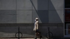 A pedestrian wearing a protective mask walks down Bank St. in Ottawa, Ontario, Canada, on Wednesday, May 20, 2020. Ontario has allowed the reopening of most stores, except for those in shopping malls. Photographer: David Kawai/Bloomberg