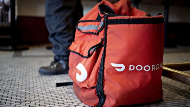 A DoorDash Inc. delivery bag sits on the floor at Chef Geoff's restaurant in Washington, D.C., U.S., on Thursday, March 26, 2020.