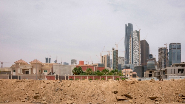 A new development stands during construction near the King Abdullah Financial District (KAFD) in Riyadh, Saudi Arabia, on Tuesday, May 19, 2020. Hit simultaneously by plunging crude prices and coronavirus shutdowns, the non-oil economy is expected to contract for the first time in over 30 years. Photographer: Tasneem Alsultan/Bloomberg