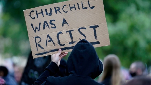 HULL, UNITED KINGDOM - JUNE 10: A demonstrator holds up a sign during a Black Lives Matter protest on June 10, 2020 in Hull, United Kingdom. The death of an African American man, George Floyd, while in the custody of Minneapolis police has sparked protests across the United States, as well as demonstrations of solidarity in many countries around the world. At the weekend, anti-racism protests across the UK resulted in some statues being vandalised. (Photo by Christopher Furlong/Getty Images)