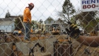A worker stands at a low income housing construction site in Schenectady, New York. Photographer: Angus Mordant/Bloomberg