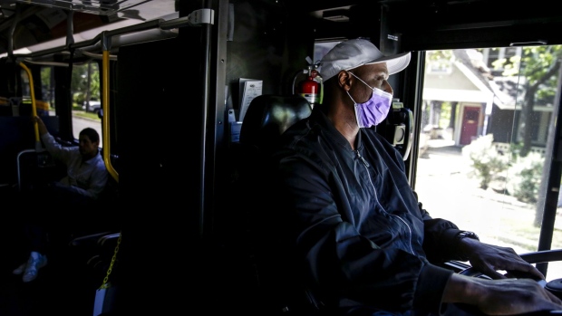 A bus driver wears a face mask in downtown Austin, Texas. Photographer: Bronte Wittpenn/Bloomberg