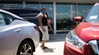 A customer wearing a protective mask looks at different cars displayed outside for sale at a Honda Motor Co. dealership in Southfield, Michigan, U.S., on Tuesday, May 26, 2020. The coronavirus pandemic ripped through the economy with frightening speed, spurring job losses in every U.S. state in April. The largest deterioration in the labor market occurred in Michigan, Vermont and New York.