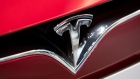 Tesla Motors Inc. badge is displayed on the front grille of Model S 90D electric vehicle at the company's showroom in Hanam, Gyeonggi Province, South Korea, on Wednesday, March 15, 2017. Tesla produced almost 84,000 vehicles in 2016 and plans to make half a million in 2018, then 1 million in 2020. Photographer: SeongJoon Cho/Bloomberg