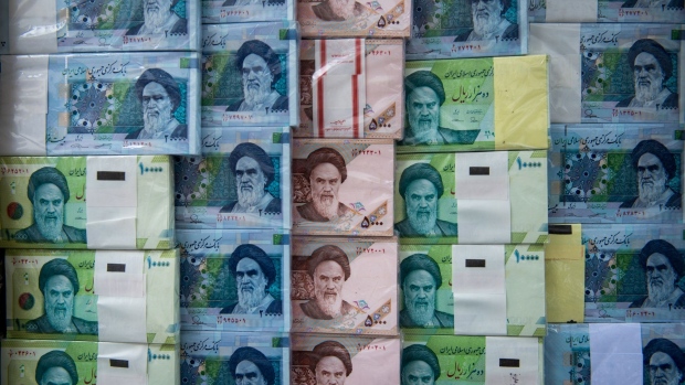 Iranian rial banknotes stand on display at a currency exchange in Tehran, Iran, on Saturday, May 18, 2019. President Donald Trump warned Iran not to threaten the U.S. or face ruinous consequences as tensions mount between Washington and Tehran. Photographer: Ali Mohammadi/Bloomberg