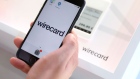 An employee demonstrates the Wirecard AG online payment smartphone app on the company's exhibition stand at the Noah Technology Conference in Berlin, Germany, on Thursday, June 13, 2019. The annual tech conference runs June 13 -14 and brings together future-shaping executives and investors.