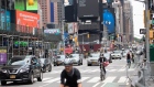 Traffic moves through Times Square in New York, U.S., on Thursday, June 11, 2020. New York streets got a little more congested this week as the city entered Phase 1 of its re-opening from the coronavirus-imposed lockdown.
