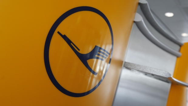 A Deutsche Lufthansa AG logo sits on display in the airline's departure lounge at Munich airport in Munich, Germany, on Wednesday, June 3, 2020. Deutsche Lufthansa AG signaled the start of a company-wide revamp spanning job cuts to asset disposals to help repay its 9 billion-euro ($10 billion) bailout from the German government. Photographer: Michaela Handrek-Rehle/Bloomberg