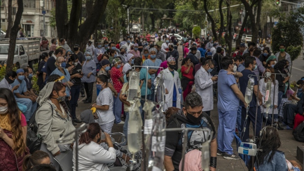 Medical staff and patients gather outside Alvaro Obregon Hospital during an earthquake in Mexico