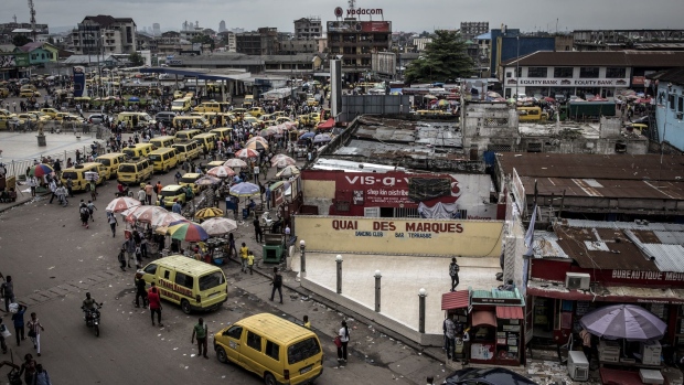 Yellow taxi van vehicles line the streets in the Victoire district of Kinshasa, Democratic Republic of the Congo, on Friday, Jan. 11, 2019. The disputed presidential election result could lead to legal challenges and a prolonged period of political uncertainty -- the last thing that's needed in a nation already confronting rampant poverty and insecurity. Photographer: John Wessels/Bloomberg