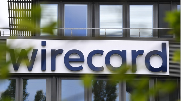 The Wirecard AG logo sits on the company's headquarters in Munich, Germany, on Thursday, June 25, 2020. Wirecard filed for insolvency, following the arrest of its CEO amid a massive accounting scandal that left the German payment-processing firm scrambling to find over $2 billion dollars missing from its balance sheet.