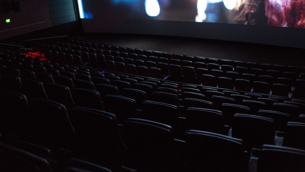 Empty seats sit inside a theater at a Cinemark Holdings Inc. location in the Playa Vista neighborhood of Los Angeles. Photographer: Christopher Lee/Bloomberg