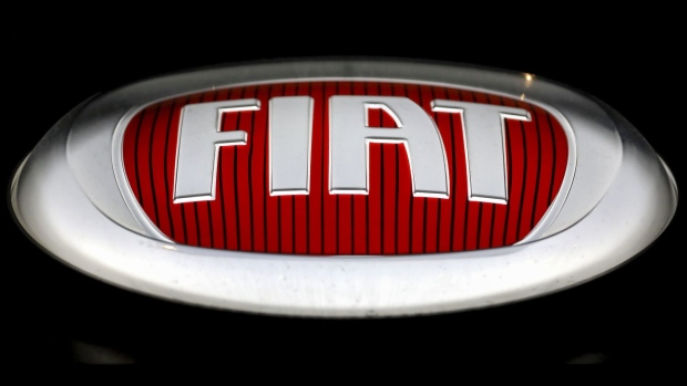 The Fiat Chrysler Automobiles NV (FCA) logo sits on the outside wall of one of the company's car dealerships in Rome, Italy, on Thursday, Oct. 31, 2019. PSA Group and Fiat Chrysler Automobiles NV’s plan to combine would create the world's fourth-largest automaker, overtaking General Motors Co. Photographer: Alessia Pierdomenico/Bloomberg
