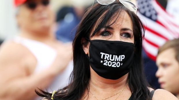 BOSTON, MASSACHUSETTS - MAY 04: A protestor wears a Trump 2020 face mask during a Reopen Massachusetts Rally outside of the Massachusetts State House on May 04, 2020 in Boston, Massachusetts. The coronavirus (COVID-19) pandemic has caused caused closure of all non-essential businesses in the state since March 23. Over 60,000 people have tested positive for COVID-19 in Massachusetts. (Photo by Maddie Meyer/Getty Images)
