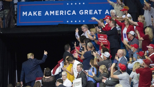 U.S. President Donald Trump gestures a thumbs up as he leaves a rally in Tulsa, Oklahoma, U.S., on Saturday, June 20, 2020. Trump's first campaign rally since the coronavirus pandemic took hold in the U.S. drew far fewer supporters than the president and his advisers had predicted, a downbeat end to a day of controversy over efforts to oust a top prosecutor in New York.