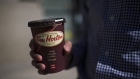 A cup of Tim Hortons Inc. coffee is displayed for a photograph in Toronto, Ontario, Canada, on Wednesday, Aug. 3, 2011. Tim Hortons Inc. is a chain of franchise fast food restaurants that serve coffee drinks, tea, soups, sandwiches, donuts, bagels, and pastries. Photographer: Brent Lewin/Bloomberg