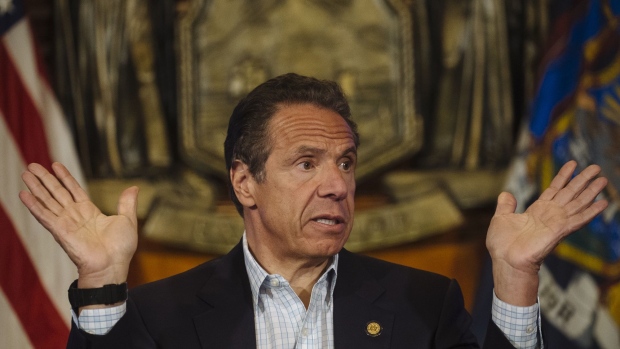 Andrew Cuomo speaks during a news conference in the Red Room of the New York State Capitol Building in Albany. Photographer: Angus Mordant/Bloomberg