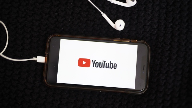 The logo for YouTube Inc. is displayed on a smartphone in an arranged photograph taken in the Brooklyn borough of New York, U.S., on Sunday, May 10, 2020. The video arm of Alphabet Inc.'s Google is offering new tools and audience statistics specifically for advertising on TV - screen space where YouTube has trailed cable channel. Photographer: Gabby Jones/Bloomberg