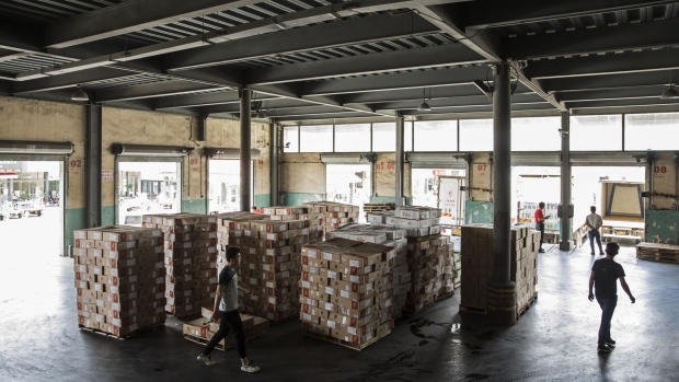 Boxes of imported meat sit stacked ready for dispatch at a distribution center in Shanghai, China, on Friday, July 13, 2018. China is scheduled to release gross domestic product (GDP) figures on July 16. Photographer: Qilai Shen/Bloomberg