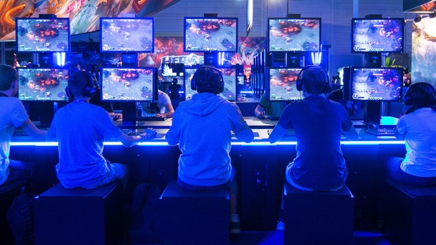 Gamers play an Activision Blizzard game during an event in Cologne, Germany. Photographer: Krisztian Bocsi/Bloomberg