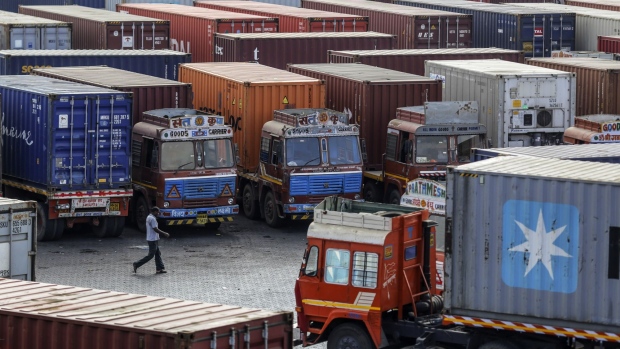 Container trucks sit parked near the Jawaharlal Nehru Port, operated by Jawaharlal Nehru Port Trust (JNPT), in Navi Mumbai, Maharashtra, India, on Saturday, May 25, 2019. President Donald Trump opened another potential front in his trade war on May 31, terminating India's designation as a developing nation and thereby eliminating an exception that allowed the country to export nearly 2,000 products to the U.S. duty-free. Photographer: Dhiraj Singh/Bloomberg