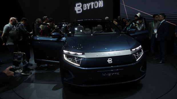 Attendees gather around a Byton Ltd. M-Byte electric sports utility vehicle (SUV) on display at the CES 2020 event in Las Vegas, Nevada, U.S., on Sunday, Jan. 5, 2020. The world's biggest technology companies head to Las Vegas for the annual CES trade show, with even Apple making a rare official appearance. Photographer: Bridgette Bennet/Bloomberg