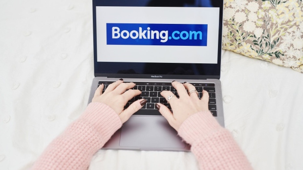 The logo for Booking Holdings Inc. is displayed on a laptop computer in an arranged photograph taken in the Brooklyn borough of New York, U.S., on Sunday, May 10, 2020. In a matter of months, the coronavirus reset the clock on a decades-long aviation boom that's been one of the great cultural and economic phenomena of the postwar world. Photographer: Gabby Jones/Bloomberg