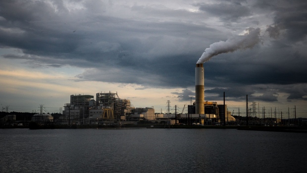 Emissions rise from the Duke Energy Corp. coal-fired Asheville Power Plant ahead of Hurricane Florence in Arden, North Carolina, U.S., on Thursday, Sept. 13, 2018. Hurricane Florence’s wrath hit the North Carolina coast, but the full effects of the storm, still centered 100 miles from shore, are yet to come.