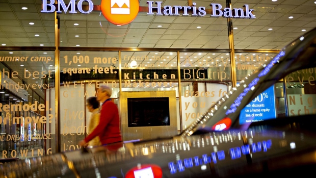 Pedestrians walk outside a BMO Harris Bank branch in the ground floor of the US Headquarters building in Chicago, Illinois, U.S., on Monday, June 11, 2018.