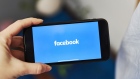 Facebook signage on a mobile device. Photographer: Gabby Jones/Bloomberg