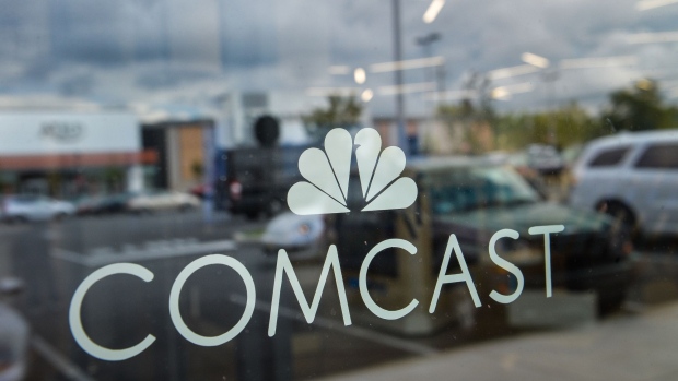 Signage is displayed in the window of a Comcast Corp. Xfinity store in King Of Prussia, Pennsylvania, U.S., on Tuesday, July 25, 2017. Comcast Corp. is scheduled to release earning figures on July 27. Photographer: Charles Mostoller/Bloomberg