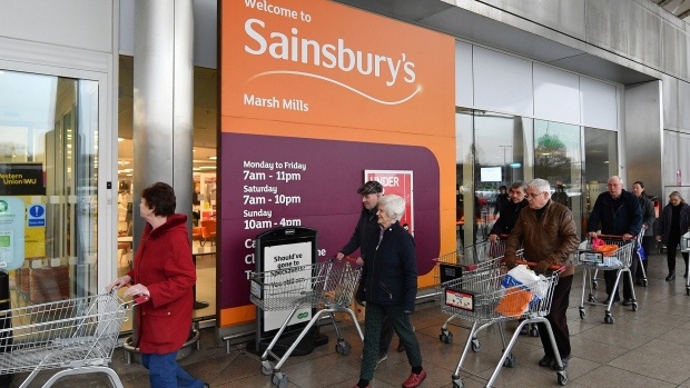 PLYMOUTH, UNITED KINGDOM - MARCH 19: Shoppers queue outside a Sainsbury's supermarket prior to opening in Plymouth on March 19, 2020 in Plymouth, United Kingdom. The store allowed only the elderly and vulnerable into the store for the first hour. After spates of "panic buying" cleared supermarket shelves of items like toilet paper and cleaning products, stores across the UK have introduced limits on purchases during the COVID-19 pandemic. Some have also created special time slots for the elderly and other shoppers vulnerable to the new coronavirus. (Photo by Dan Mullan/Getty Images)