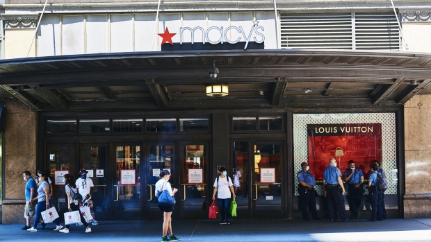 Customers exit the Macy's Inc. flagship store in the Herald Square area of New York, U.S., on Monday, June 22, 2020. No city is more important to America’s economic recovery than New York. The economic output of the New York metro area, estimated at $1.8 trillion, rivals that of entire nations. Photographer: Gabby Jones/Bloomberg