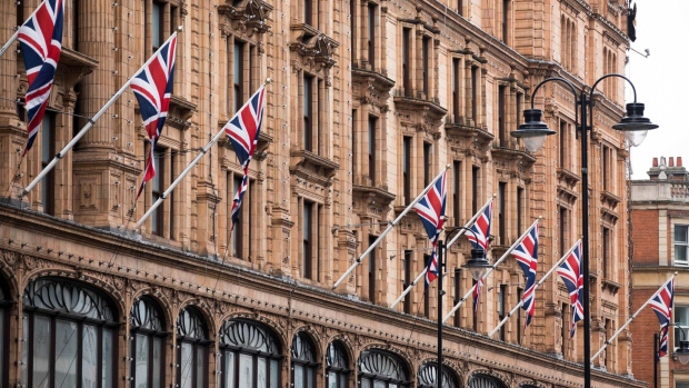 British Union flags fly outside Harrods. Photographer: Chris Ratcliffe/Bloomberg