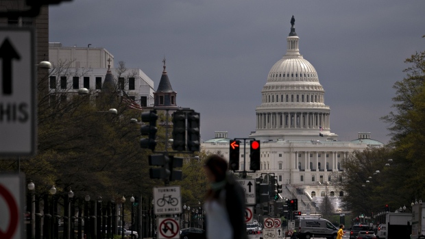 The U.S. Capitol stands past Pennsylvania Avenue in Washington, D.C., U.S., on Wednesday, April 1, 2020. 