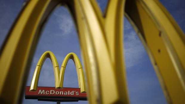 Signage stands outside a McDonald's Corp. fast food restaurant in Bowling Green, Kentucky, U.S. Photographer: Luke Sharrett/Bloomberg