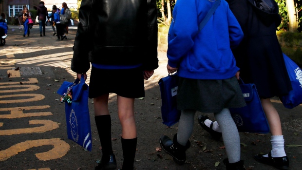 ALTRINCHAM, UNITED KINGDOM - MARCH 20: Children walk home from Altrincham C.E. aided primary school after the government's policy to close all schools from today due to the coronavirus pandemic on March 20, 2020 in Altrincham, United Kingdom. Coronavirus (COVID-19) has spread to at least 182 countries, claiming over 10,000 lives and infecting more than 250,000 people. There have now been 3,269 diagnosed cases in the UK and 184 deaths. (Photo by Clive Brunskill/Getty Images)