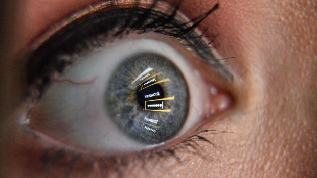 LONDON, ENGLAND - AUGUST 09: In this photo illustration, an image of a password login dialog box is reflected on the eye of a young woman on August 09, 2017 in London, England. With so many areas of modern life requiring identity verification, online security remains a constant concern, especially following the recent spate of global hacks. (Photo by Leon Neal/Getty Images) Photographer: Leon Neal/Getty Images Europe