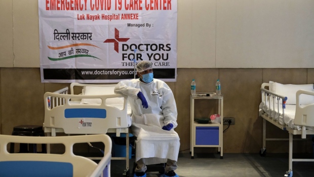 A nurse rests in a makeshift ward at an emergency Covid-19 care center set up in the Shehnai Banquet Hall at the Lok Nayak Jai Prakash Hospital Annexe in New Delhi, India, on Wednesday, June 24, 2020. Developing countries face an explosion in coronavirus infections as they exit lockdowns amid worsening outbreaks because the economic cost of remaining shuttered is too great. Photographer T. Narayan/Bloomberg Photographer: T. Narayan/Bloomberg