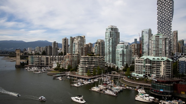 Boats travel in False Creek near the downtown Vancouver, British Columbia, Canada, on Sunday, June 2, 2019. Canada is scheduled to release gross domestic product (GDP) figures on June 28. Photographer: SeongJoon Cho/Bloomberg