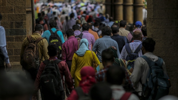 Commuters exit the Chhatrapati Shivaji Maharaj Terminus (CST) railway station in Mumbai, India, on Monday, July 6, 2020. The Sensex is headed for a four-month high, even as India overtook Russia to become the country with the third-largest caseload of coronavirus infections. Only the U.S. and Brazil now have more infections than India.