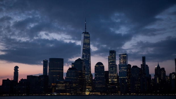 Buildings stand in the Lower Manhattan skyline at dawn as seen from Jersey City, New Jersey, U.S., on Tuesday, April 21, 2020. Treasury futures ended Tuesday mixed, with front-end yields slightly cheaper on the day and rest of the curve richer, yet off session lows reached during U.S. morning. Photographer: Michael Nagle/Bloomberg