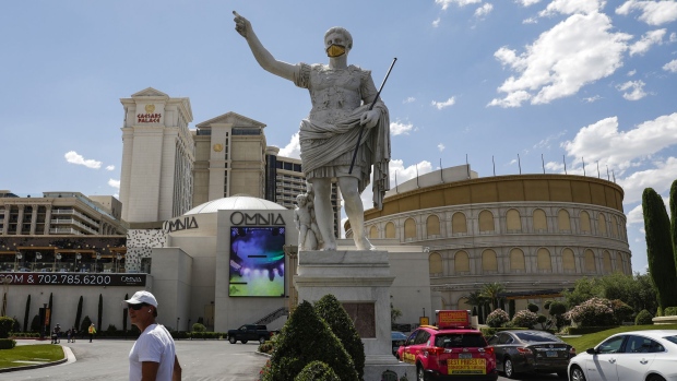 A pedestrian walks in front of Caesars Entertainment Corp.'s Caesars Palace hotel in Las Vegas on June 4.