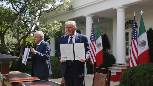 Donald Trump, right, and Andres Manuel Lopez Obrador, hold up joint declarations after being signed during a ceremony in the Rose Garden of the White House in Washington, D.C., U.S., on July 8.