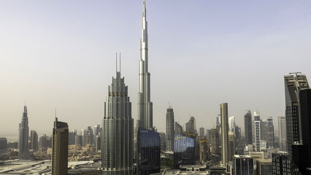 The Burj Khalifa skyscraper, center, towers above commercial and residential properties in Dubai, United Arab Emirates, on Tuesday, July 23, 2019. Like the rest of the city, the business center has suffered from a prolonged real-estate slump brought on by oversupply and slower economic growth.